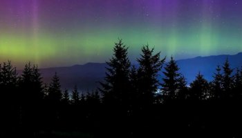 The Aurora Borealis puts on a stunning show when a solar storm hits Earth See pics